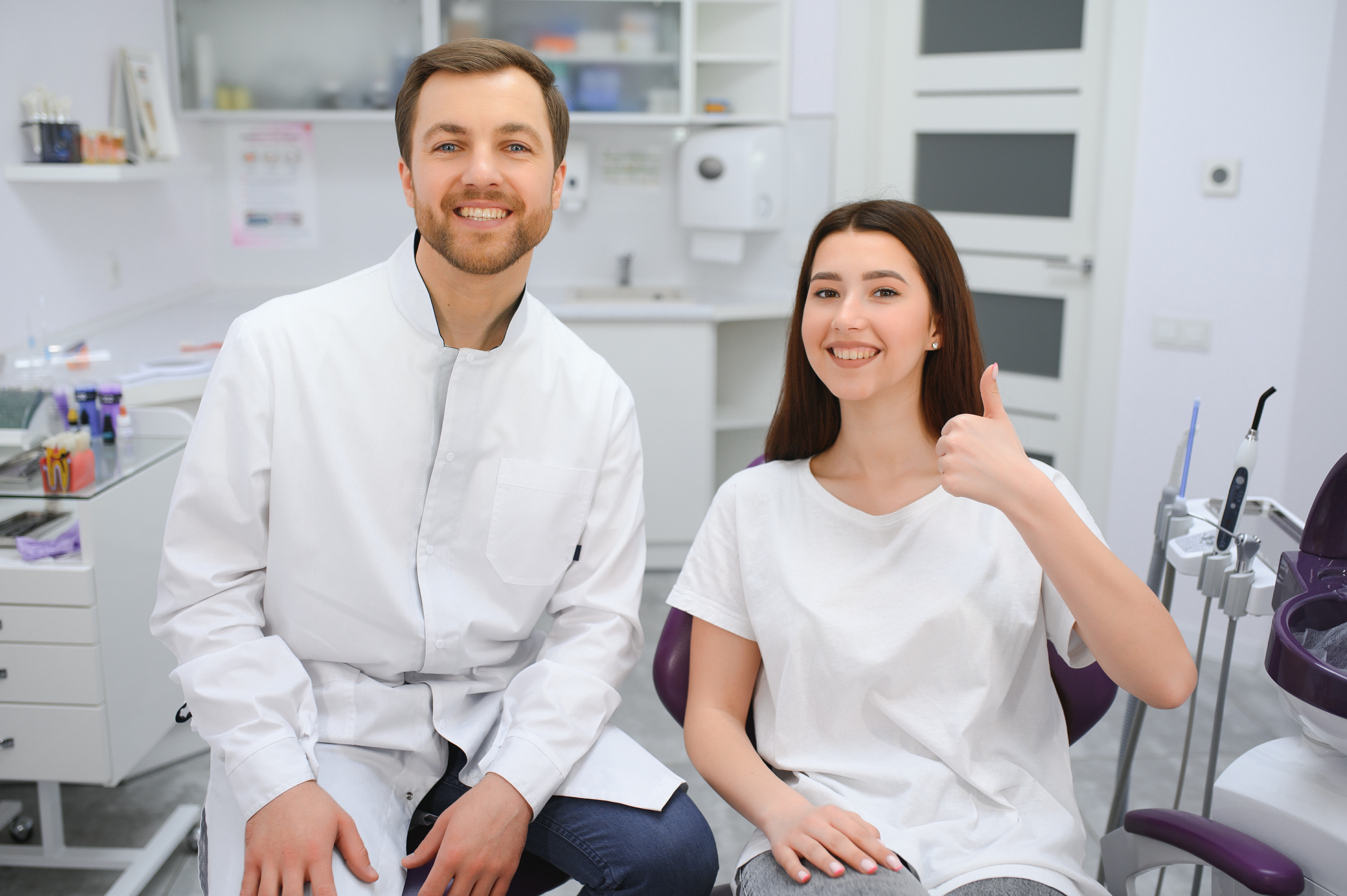 Dentist and patient smiling in a modern clinic